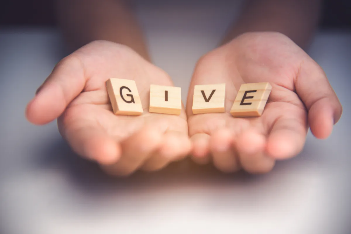 The antidote for greed is giving. (photobyphotoboy/Shutterstock)
