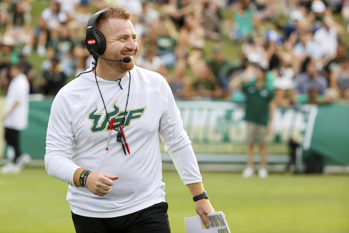 South Florida NCAA college football head coach Alex Golesh smiles during a spring scrimmage in Tampa, Fla., on April 14, 2023. (Luis Santana/Tampa Bay Times via AP)