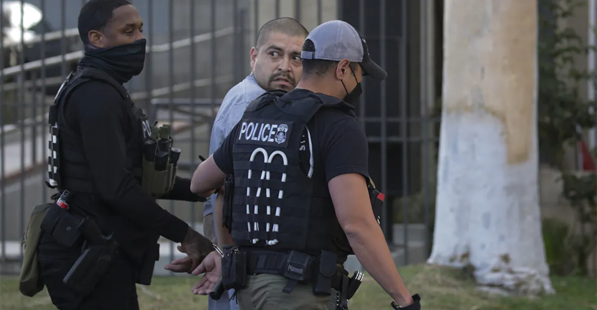 Immigration and Customs Enforcement agents apprehend an illegal alien with a criminal record in an early morning raid at home, in Los Angeles on Sept. 8, 2022. (Irfan Khan, Los Angeles Times/Getty Images)
