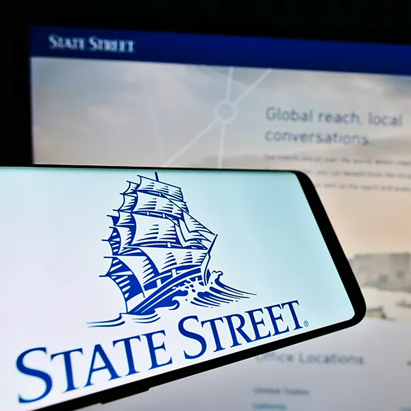 Smartphone with logo of US financial services company State Street Corp. on screen in front of website. Focus on center-right of phone display, in Stuttgart, Germany, on May 22, 2021. (Unmodified photo)