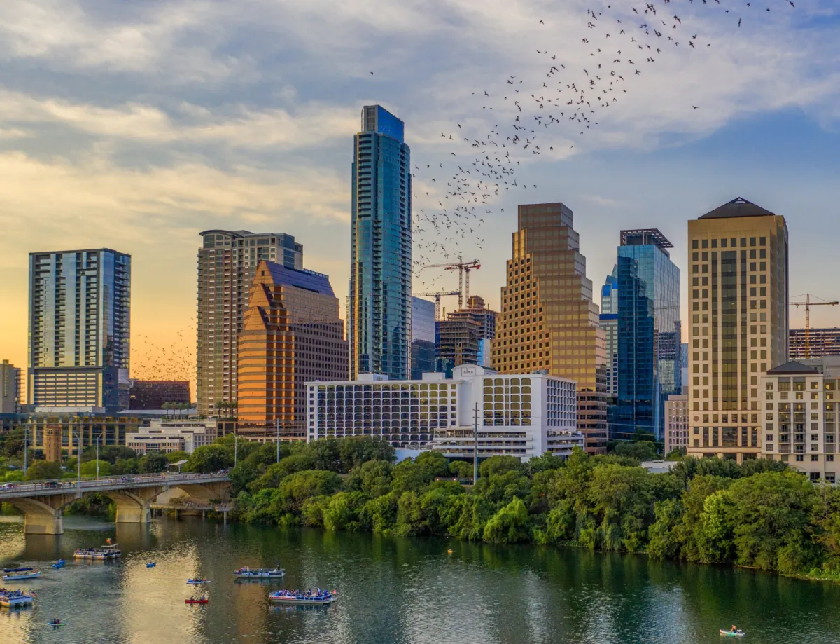 The Austin skyline from Lady Bird Lake. From late spring to early fall, 1.5 million freetail Mexican bats take off nightly from under the Congress Avenue Bridge. (Christopher V. Sherman/Visit Austin/TNS)