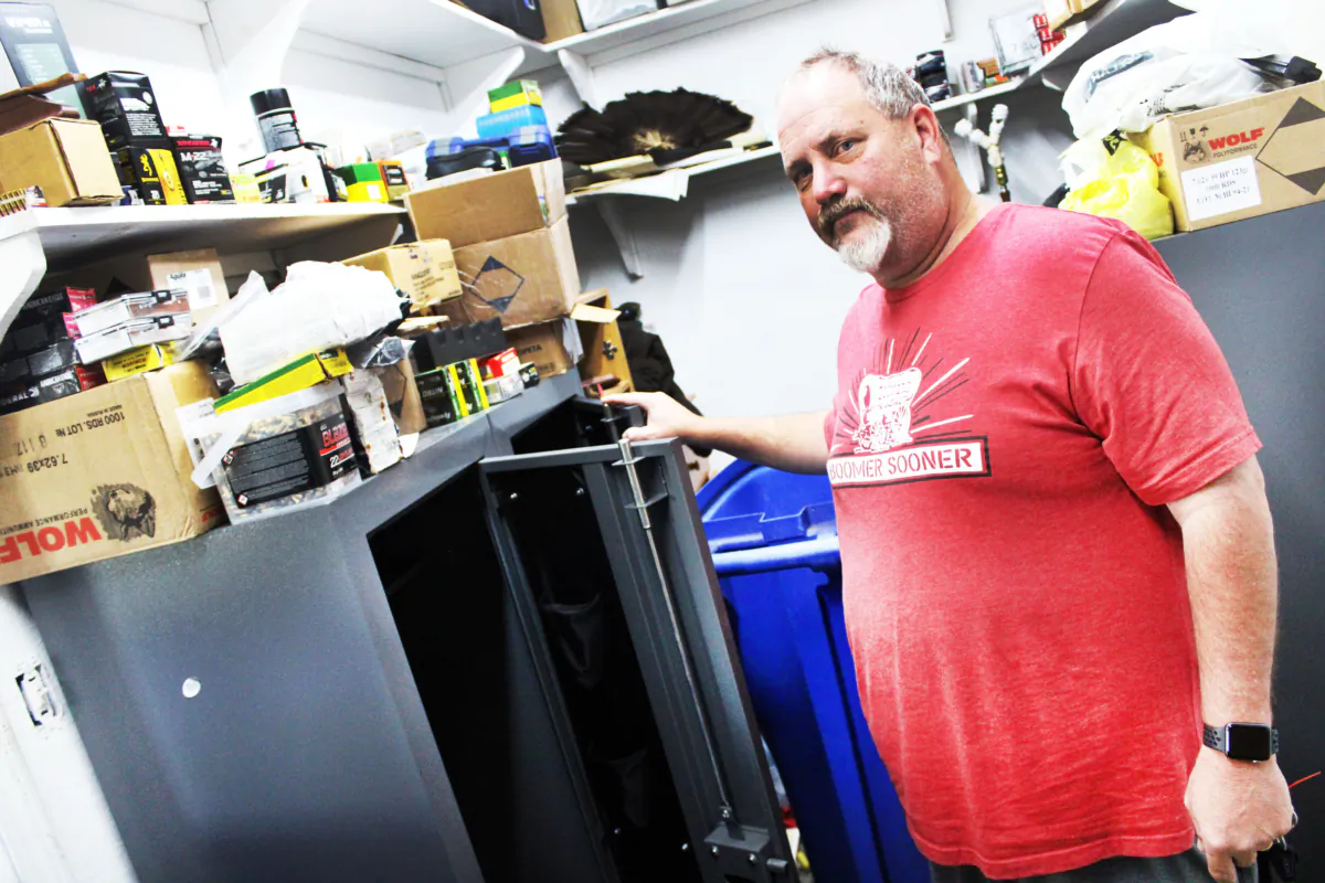 Russell Fincher stands in front of one of his gun safes emptied by Bureau of Alcohol, Tobacco, Firearms and Explosives agents during a June 16, 2023 raid on his home in Tuskahoma, Oklahoma, on Sept. 1, 2023. (Michael Clements/The Epoch Times)