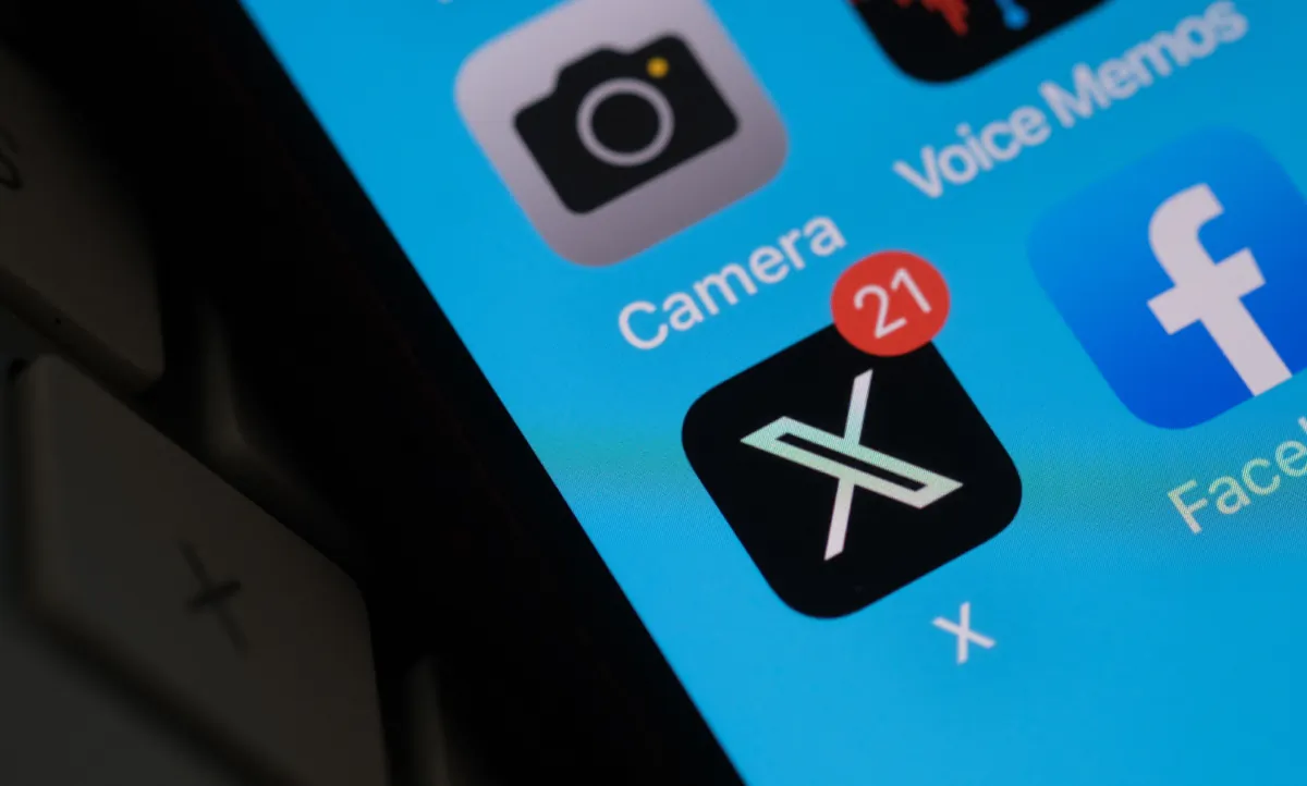 The X and Facebook logos on a smartphone screen in a file photo. (Chris Delmas/AFP via Getty Images)