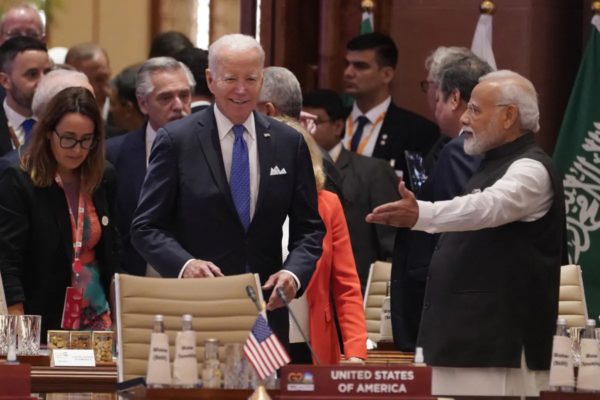 U.S. President Joe Biden (C) and Indian Prime Minister Narendra Modi (R) arrive for the first session of the G20 Leaders' Summit in New Delhi on Sept. 9, 2023. (Evan Vucci/POOL/AFP via Getty Images)