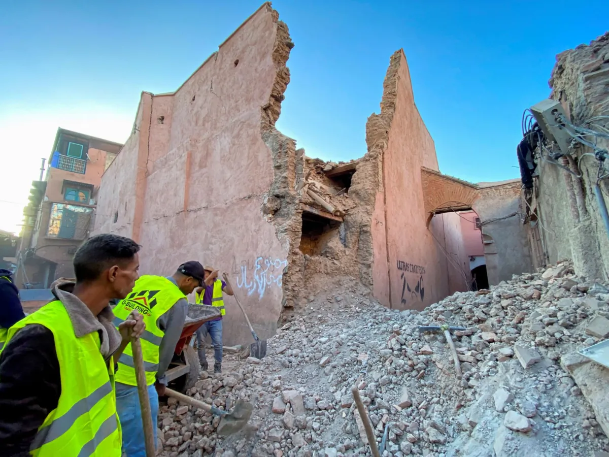 People work next to damage in the historic city of Marrakech, following a powerful earthquake in Morocco, on Sept. 9, 2023. (Abdelhak Balhaki/Reuters)