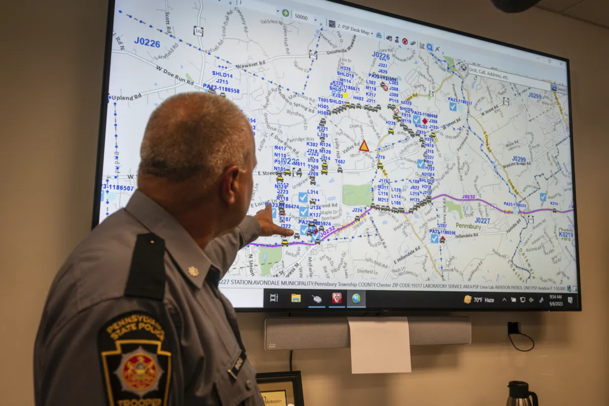 Lt. Col George Vivens shows th map of the area delineated by law enforcement and their vehicles, during a media tour, at the Incident Command Center Where Pennsylvania State Troopers, U.S. Border Patrol, Chester County Emergency Management, and FBI are collaborating on the intergovernmental manhunt searching for escaped inmate Danelo Cavalcante, at the Po-Mar-Lin Fire Company, in Unionville, Pa., on Sept. 8, 2023. (Jessica Griffin/The Philadelphia Inquirer via AP)