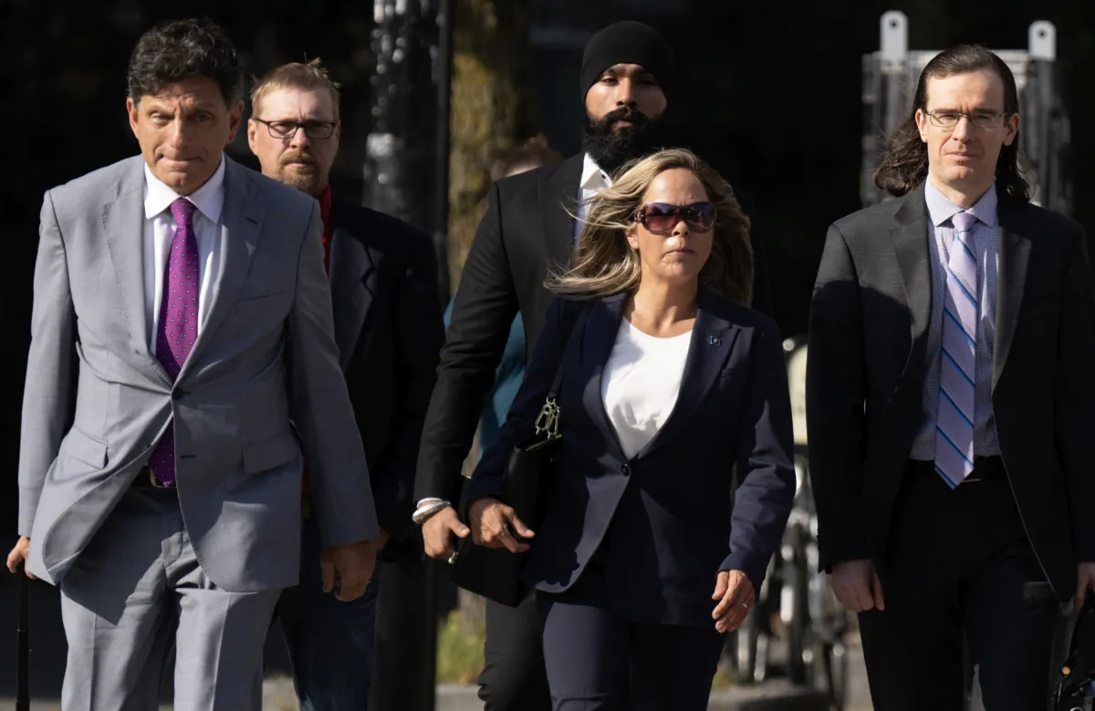 Tamara Lich walks with her lawyer Lawrence Greenspon (L) as they make their way to the courthouse on the first day of Lich’s trial, in Ottawa on Sept. 5, 2023. (The Canadian Press/Adrian Wyld)