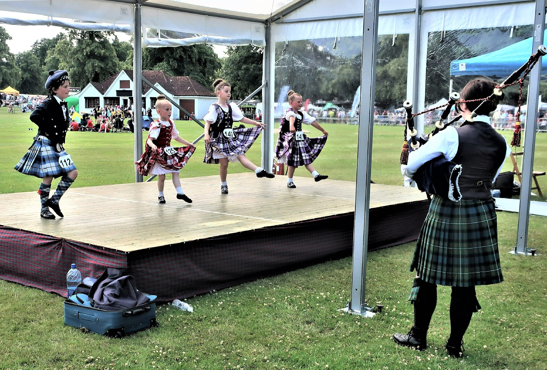 Young dancers perform at the Highland Games near Inverness, Scotland.