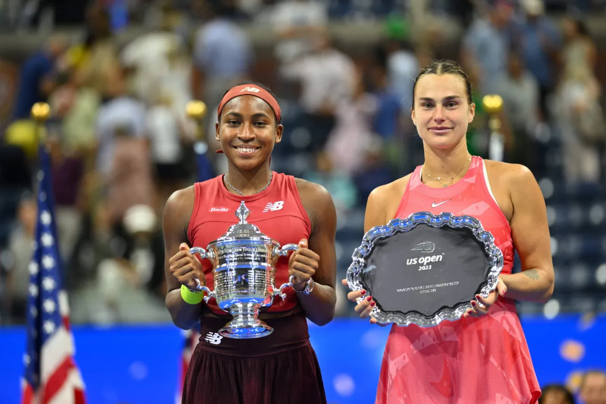 Coco Gauff of the United States and Aryna Sabalenka of Belarus hold their trophies after Gauff won the US Open tennis tournament women's singles final match at the USTA National Tennis Center in New York on Sept. 9, 2023. (Angela Weiss/AFP via Getty Images)