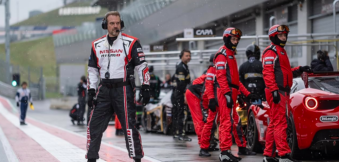 a pit crew in dressed in red in GRAN TURISMO
