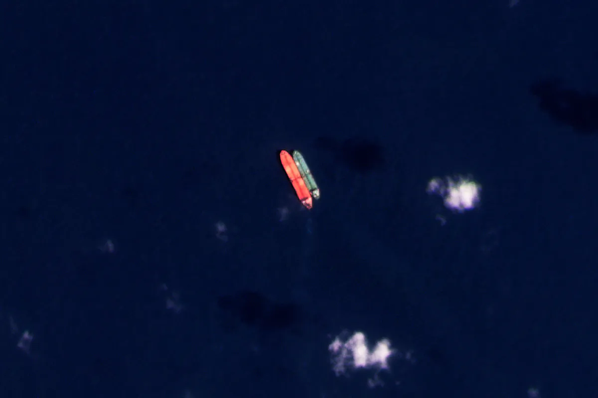 Vessels identified as the Virgo (left) and the Suez Rajan (right) by the advocacy group United Against Nuclear Iran, are seen in the South China Sea on Feb. 13, 2022. (Planet Labs PBC via AP)