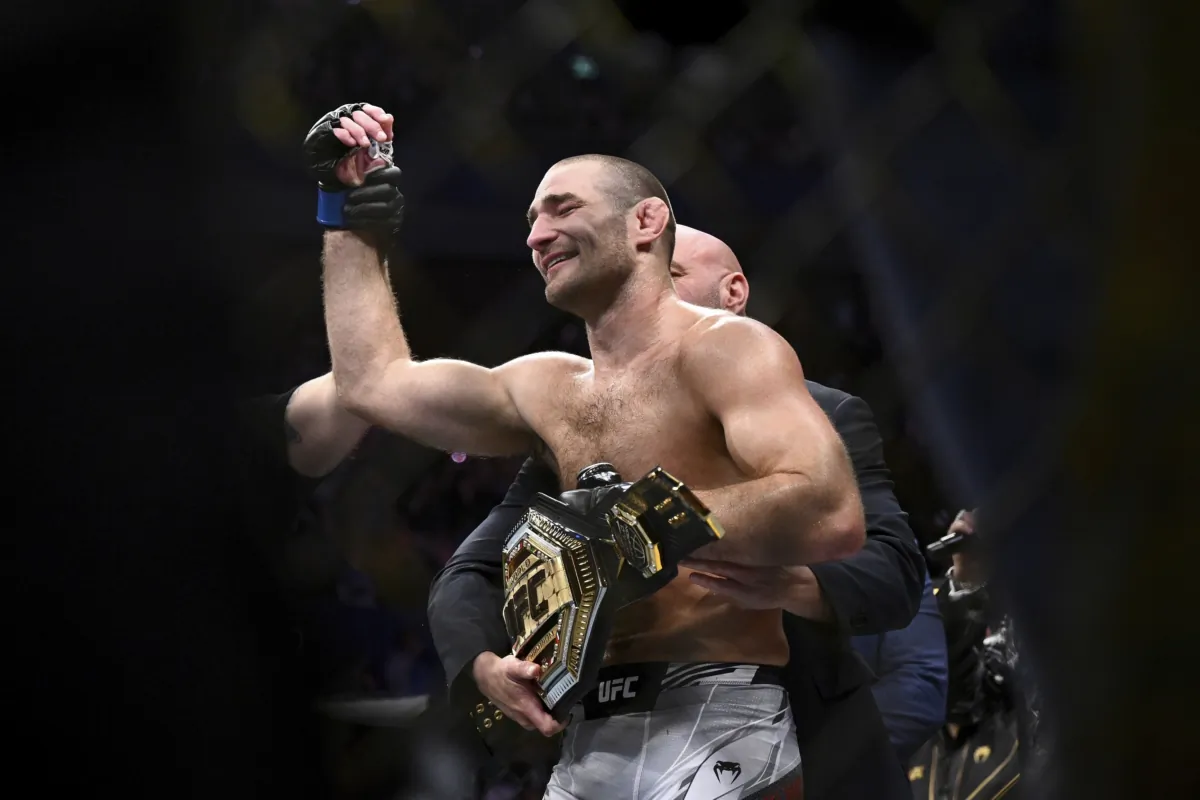 American Sean Strickland celebrates defeating Nigerian-born New Zealander Israel Adesanya to claim the middleweight title by unanimous decision in the main event of UFC 293 in Sydney on Sept. 10, 2023. (Dan Himbrechts/AAP Image via AP)