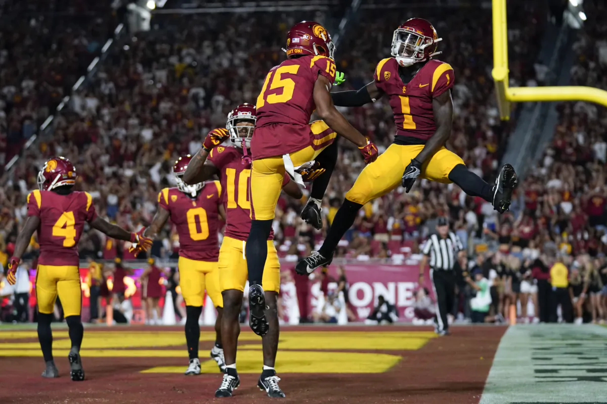 Southern California wide receiver Dorian Singer (15) and wide receiver Zachariah Branch (1) celebrate after a touchdown during the first half of an NCAA college football game against Stanford in Los Angeles on Sept. 9, 2023. (Ashley Landis/AP Photo)