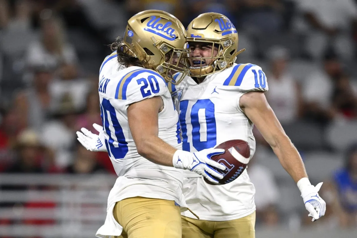UCLA Bruins running back Carsen Ryan (20) celebrates with wide receiver Ryan Cragun (10) after scoring a touchdown against the San Diego State Aztecs during the second half at Snapdragon Stadium in San Diego on Sept. 9, 2023. (Orlando Ramirez/USA TODAY Sports via Field Level Media)