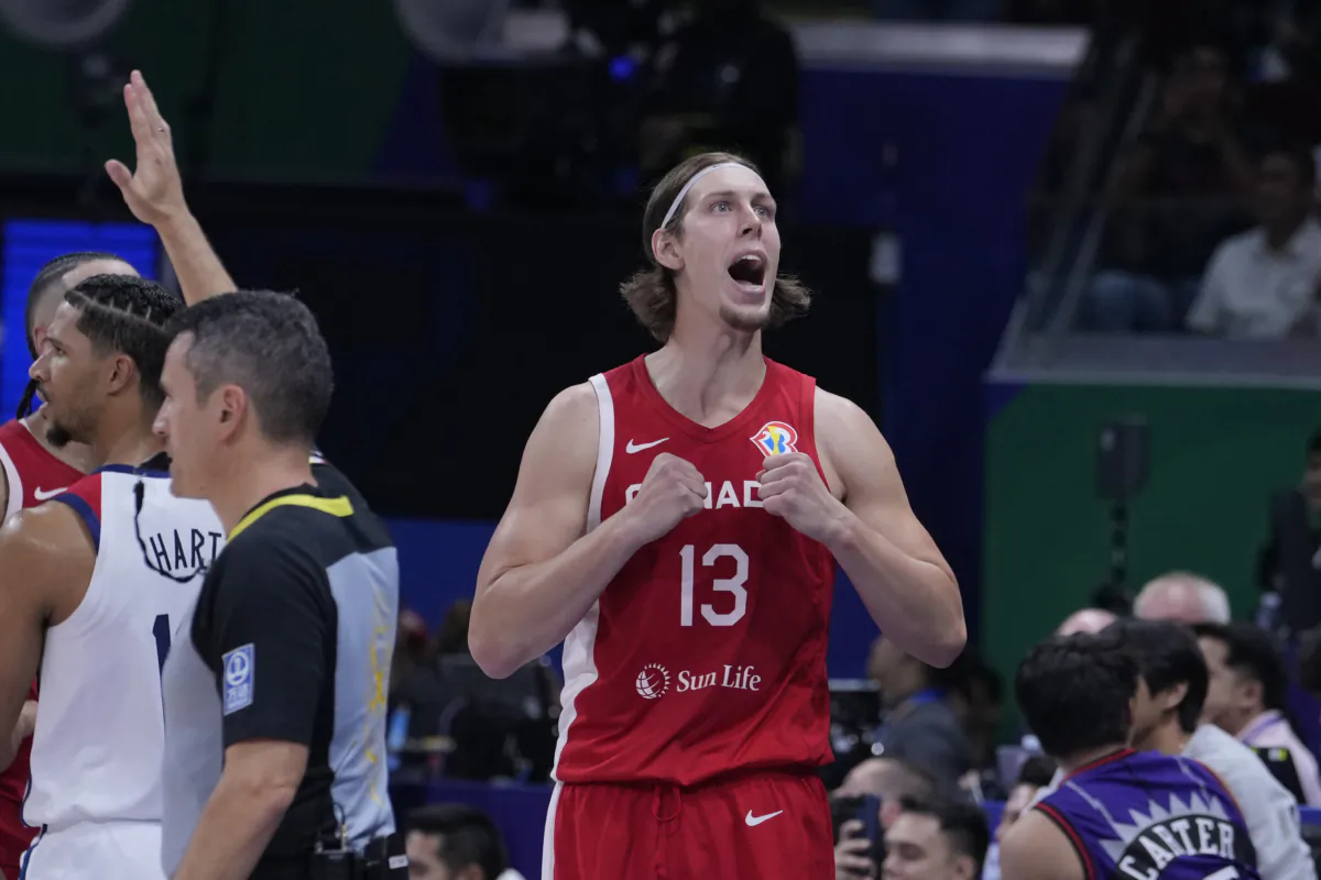 Canada forward Kelly Olynyk (13) reacts after a missed shot during the Basketball World Cup bronze medal game between the United States and Canada in Manila, Philippines, on Sept. 10, 2023. (Michael Conroy/AP Photo)