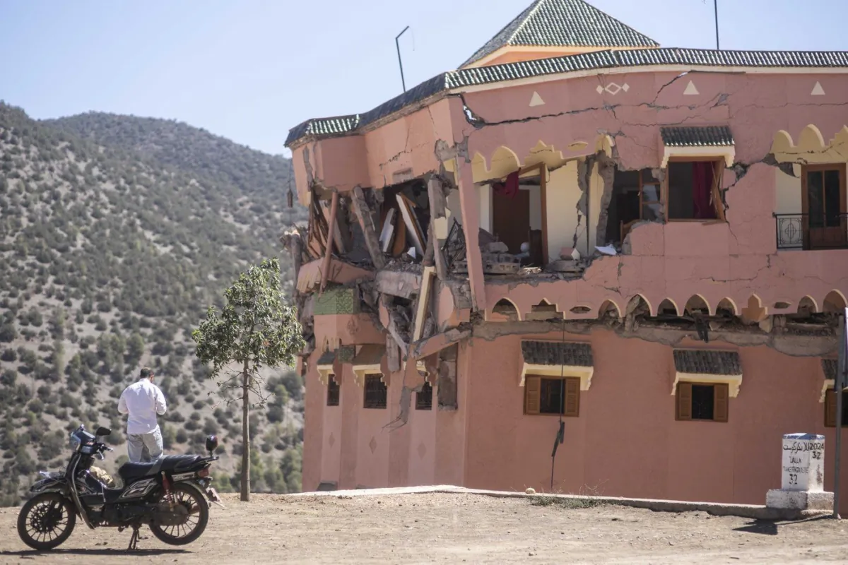 A man stands next to a damaged hotel after the earthquake in Moulay Ibrahim village, near the epicentre of the earthquake, outside Marrakech, Morocco, Sept. 9, 2023. (The Canadian Press/AP-Mosa'ab Elshamy)