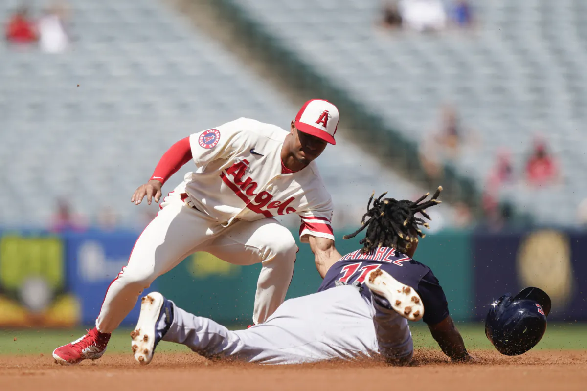 Los Angeles Angels shortstop Kyren Paris tags out Cleveland Guardians designated hitter Jose Ramirez attempting to steal second during the first inning of a baseball game in Anaheim, Calif., on Sept. 10, 2023. (AP Photo/Ryan Sun)