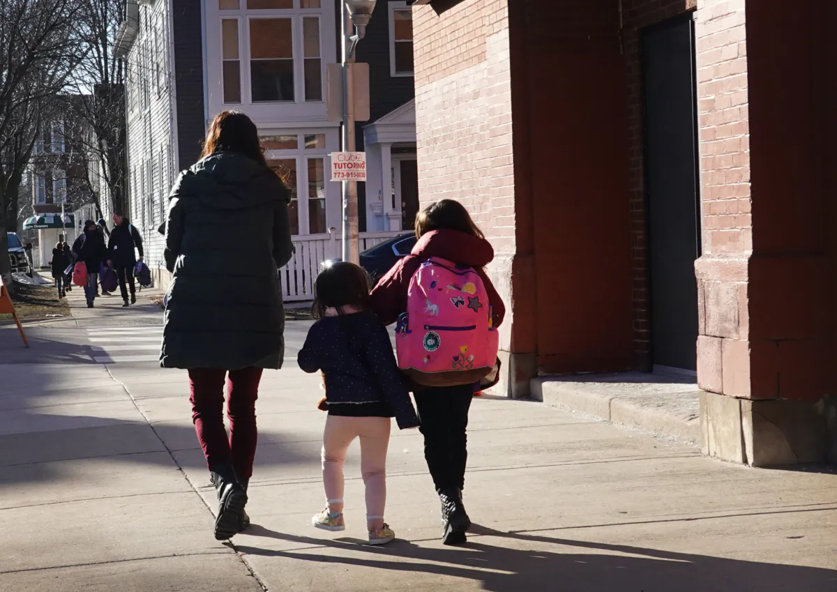 Parents pick up their children from school in Chicago, Ill., on March 1, 2021. (Scott Olson/Getty Images)