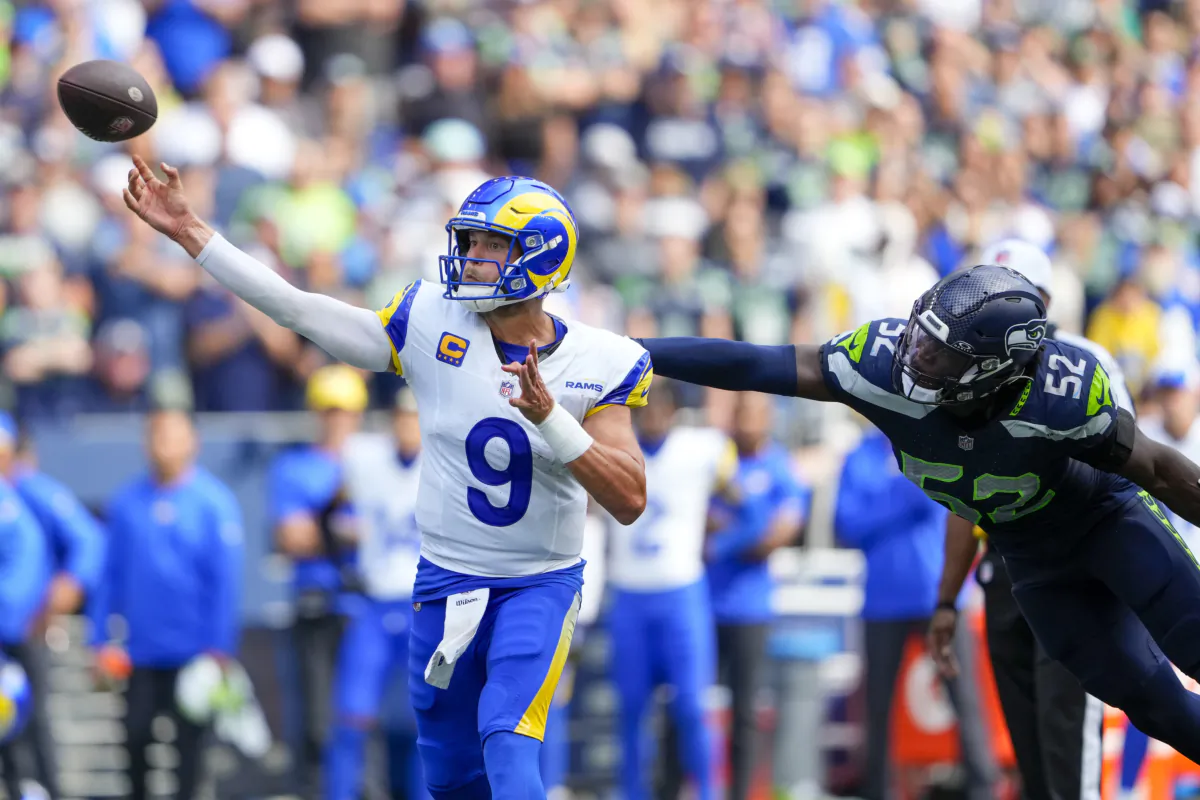 Los Angeles Rams quarterback Matthew Stafford passes under pressure from Seattle Seahawks linebacker Darrell Taylor during the second half of an NFL football game in Seattle on Sept. 10, 2023. (Lindsey Wasson/AP Photo)