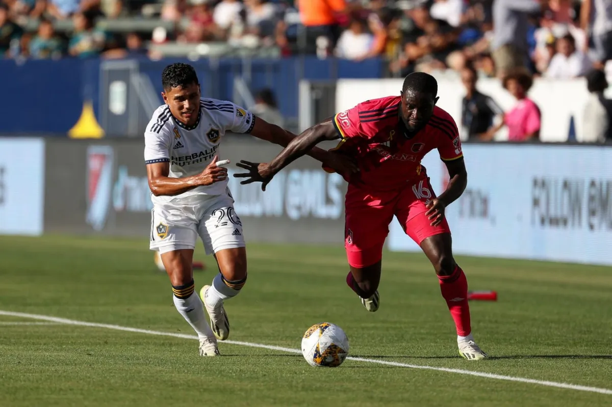 St. Louis City SC forward Samuel Adeniran (16) controls the ball under pressure from Los Angeles Galaxy midfielder Edwin Cerrillo (20) in the first half at Dignity Health Sports Park in Carson, Calif., on Sept. 10, 2023. (Kiyoshi Mio/USA TODAY Sports via Field Level Media)