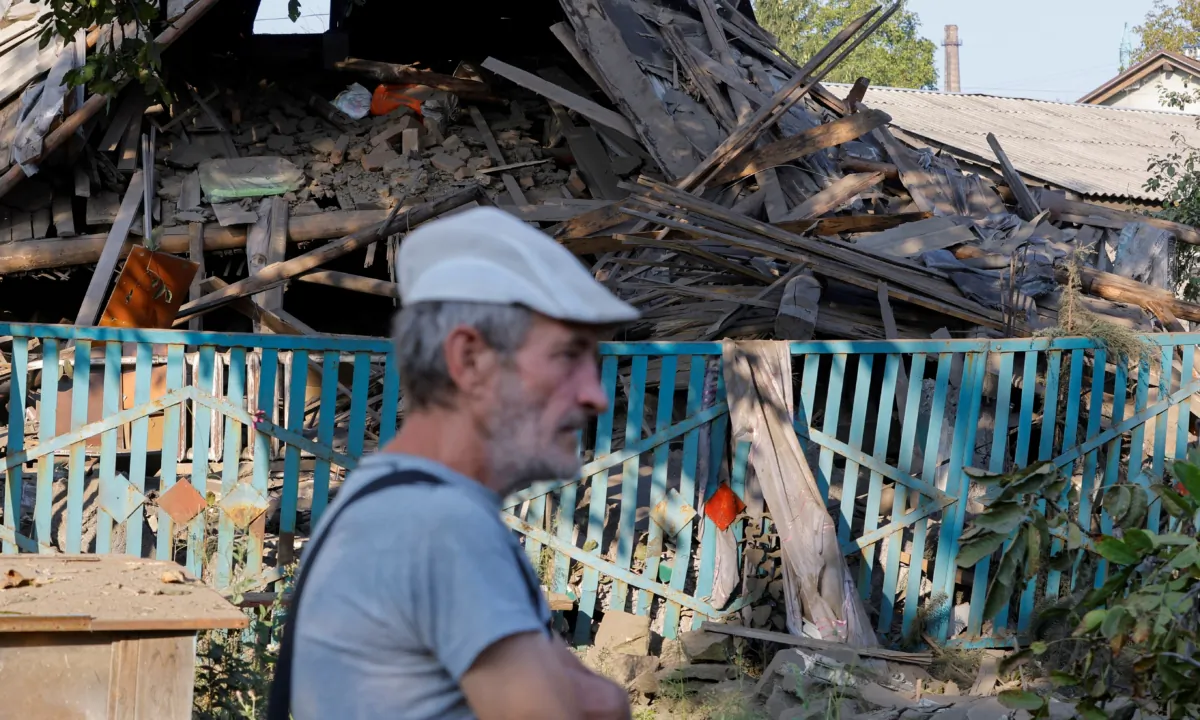 A man walks past a house destroyed by recent shelling in the course of Russia-Ukraine conflict in Donetsk, Russian-controlled Ukraine, on Sept. 11, 2023. (Alexander Ermochenko/Reuters)
