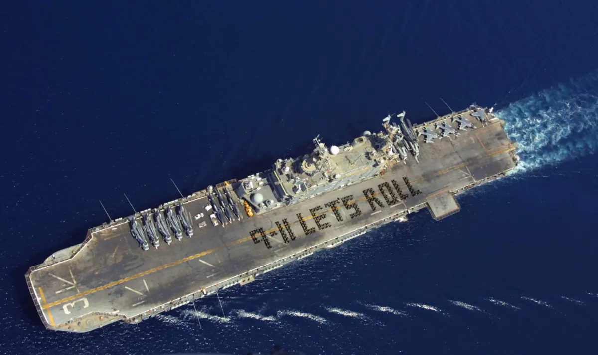 More than 500 Marines and Sailors with the 11th Marine Expeditionary Unit (Special Operations Capable) and USS Belleau Wood commemorate the one-year anniversary of the Sept. 11 terrorist attacks Sept. 6, 2002, by spelling out the now famous quote from Todd Beamer, on the flight deck of the ship. Beamer was one of the passengers on United Flight 93, which crashed in a western Pennsylvania field after he and several other passengers attempted to regain control of the plane from terrorist hijackers. (Mate Steven L. Cooke/U.S. Navy/Getty Images)