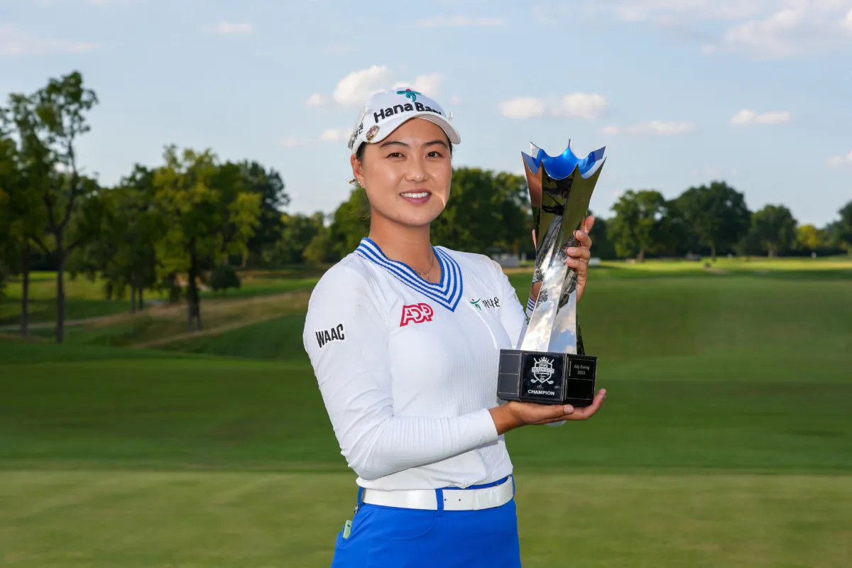 Minjee Lee of Australia celebrates with the trophy after winning in a two-hole playoff against Charley Hull (not pictured) of England during the final round of the Kroger Queen City Championship presented by P&G at Kenwood Country Club in Cincinnati on Sept. 10, 2023. (Dylan Buell/Getty Images)