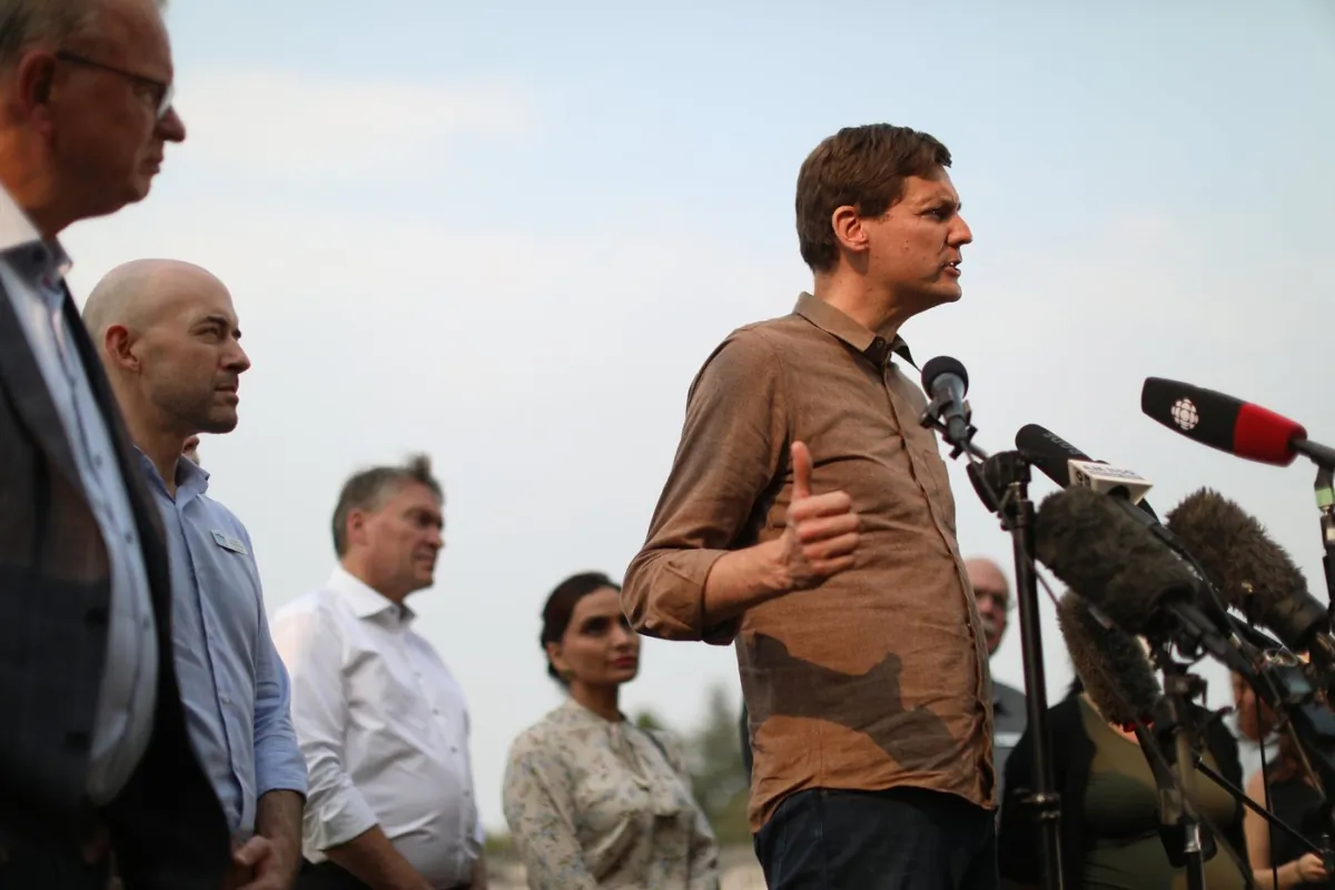 B.C. Premier David Eby holds a press conference at a reception centre for those evacuated due to the McDougall Creek wildfire in West Kelowna, B.C., on Aug. 22, 2023. (The Canadian Press/Chad Hipolito)