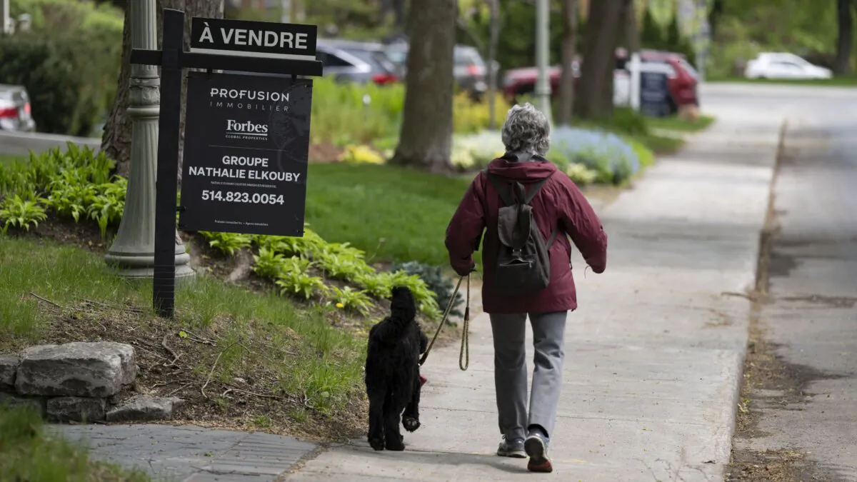Real estate signage advertises a home for sale in Montreal on May 15, 2023. (The Canadian Press/Christinne Muschi)