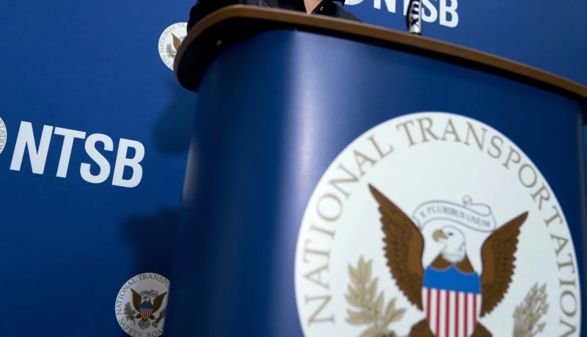 The National Transportation Safety Board logo and signage are seen at a news conference at NTSB headquarters in Washington on Dec. 18, 2017. (Andrew Harnik/AP Photo)