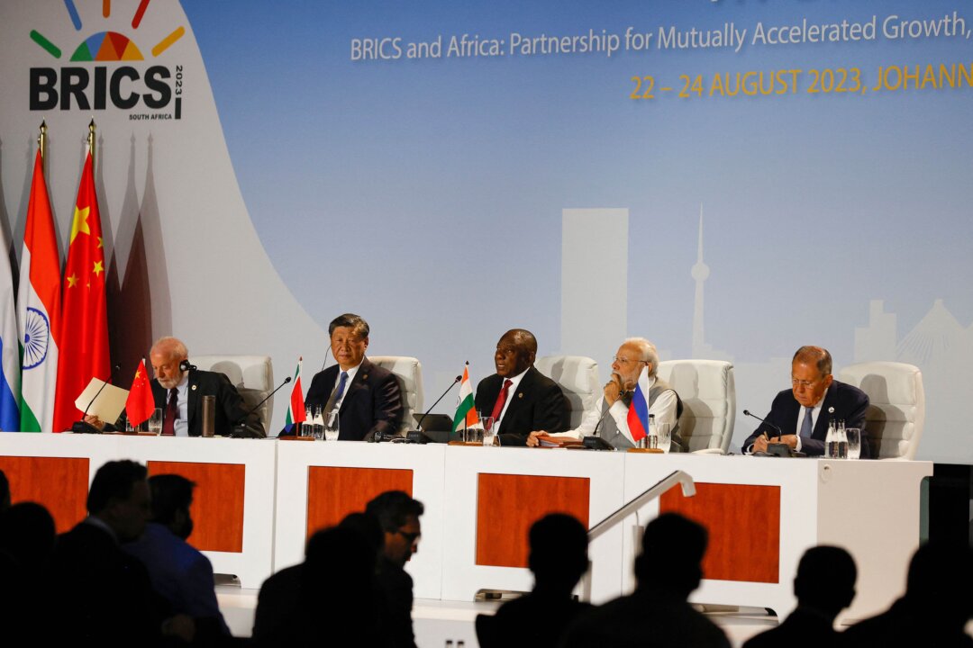 (From L to R) Brazilian President Luiz Inacio Lula da Silva, Chinese leader Xi Jinping, South African President Cyril Ramaphosa, Indian Prime Minister Narendra Modi, and Russian Foreign Minister Sergei Lavrov attend the 2023 BRICS Summit at the Sandton Convention Center in Johannesburg on Aug. 24, 2023. (Phill Magakoe/AFP via Getty Images)