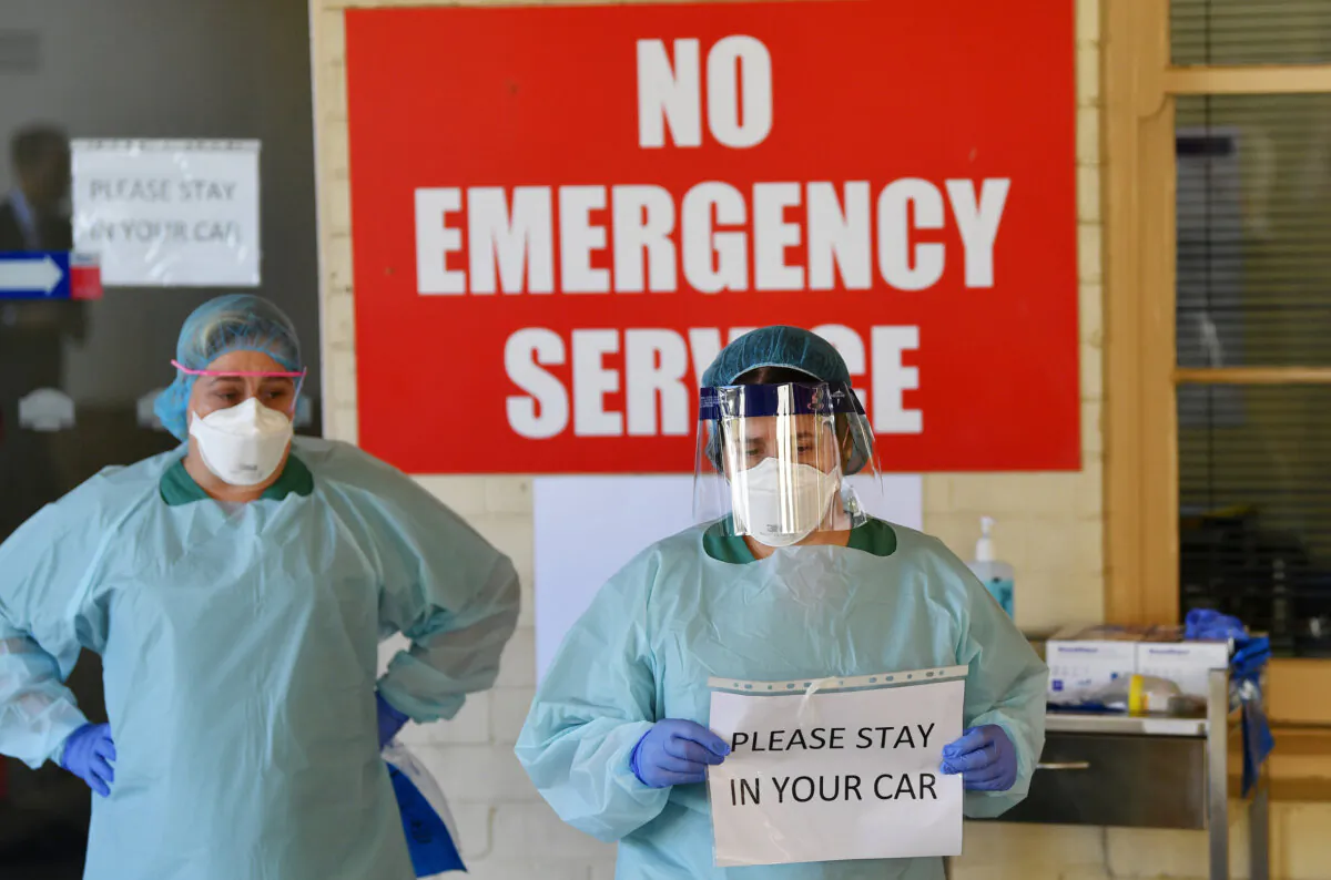 South Australia Hospital staff simulate a drive through coronavirus testing at the Repatriation Hospital in Adelaide, Australia, on March 10, 2020. (AAP Image/David Mariuz)