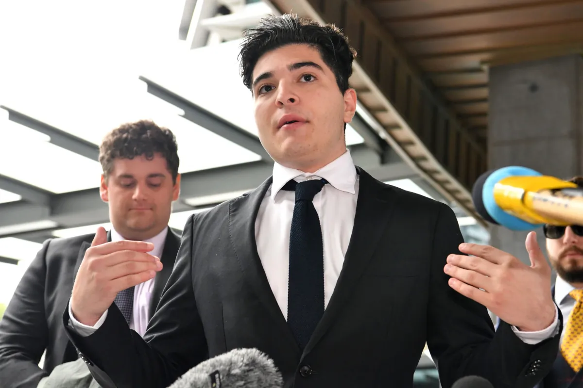 Drew Pavlou is seen talking to the media outside the Brisbane Magistrates Court in Brisbane, Monday, August 10, 2020. The court has dismissed a public order complaint by suspended University of Queensland student Drew Pavlou against the Chinese consul-general in Brisbane Xu Jie. (AAP Image/Darren England) NO ARCHIVING