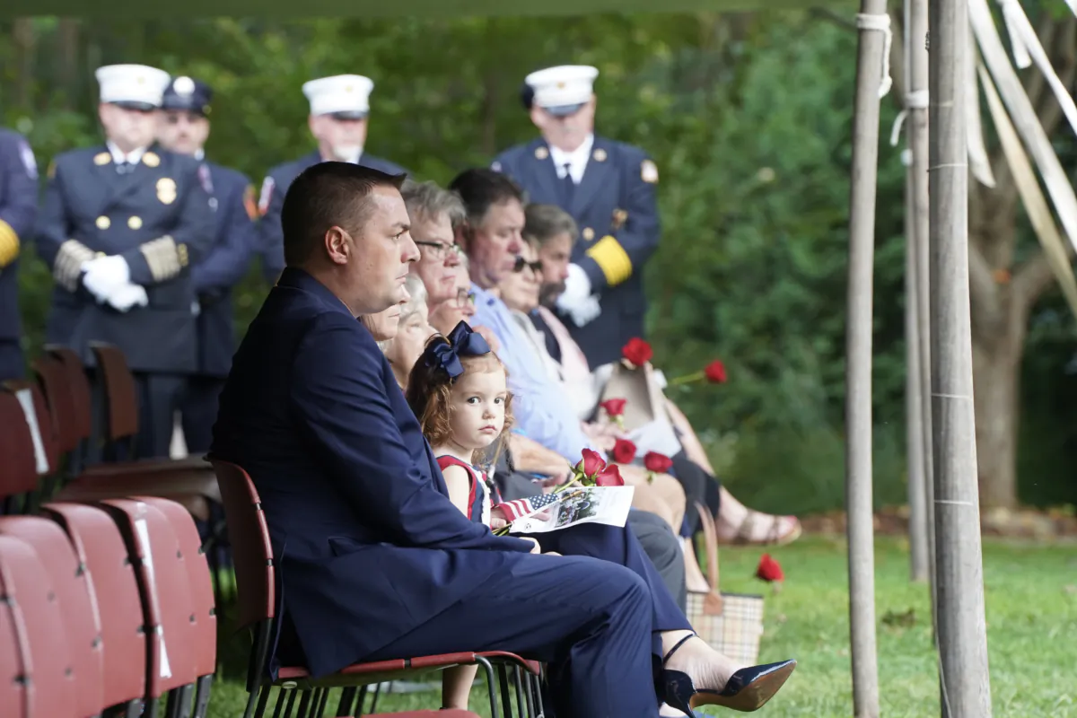 Family members who lost loved ones to Sept. 11 terrorist attacks attend the Orange County September 11th Remembrance Ceremony at Orange County Arboretum in Montgomery, N.Y., on Sept. 11, 2023. (Cara Ding/The Epoch Times)
