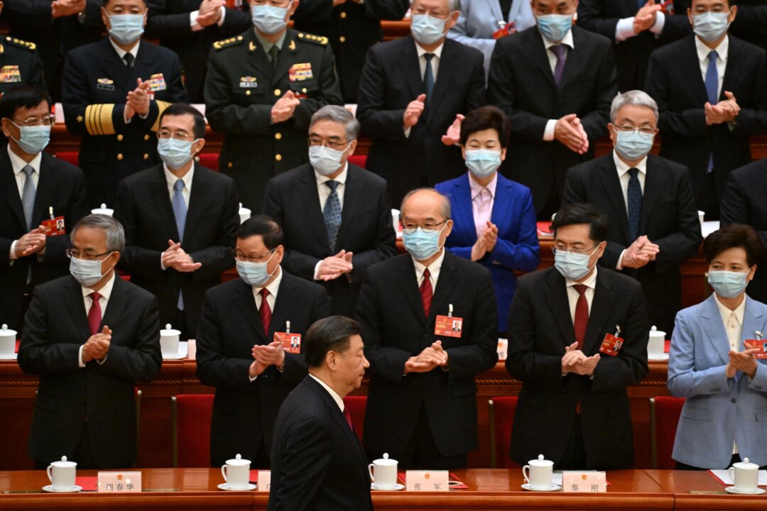 Delegates, including Foreign Minister Qin Gang (2nd R), applaud as Chinese leader Xi Jinping (bottom C) arrives for the closing session of the National People's Congress at the Great Hall of the People in Beijing on March 13, 2023. (Noel Celis/Pool/AFP via Getty Images)
