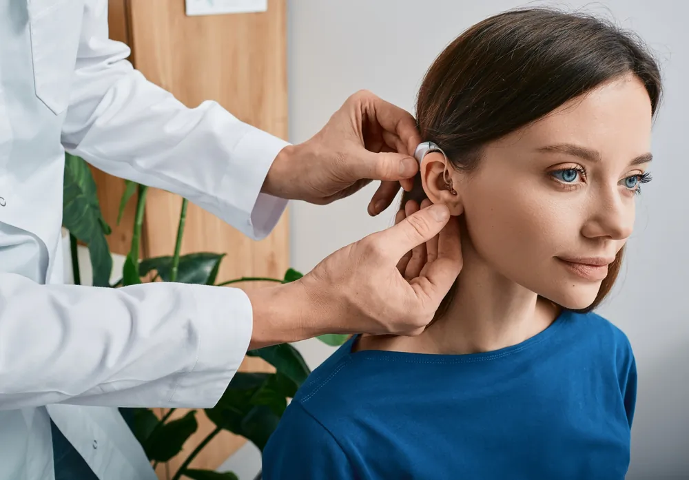 People hard-of-hearing have benefitted from a hearing aid invented by Miller Reese Hutchison. (Peakstock/Shutterstock)