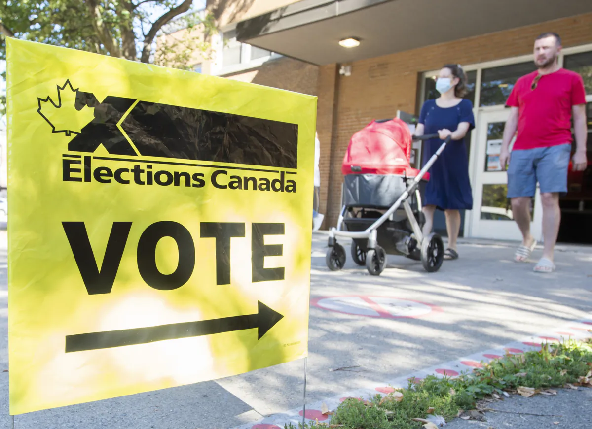 People leave a polling station after voting on federal election day in Montreal, on Sept. 20, 2021. (The Canadian Press/Graham Hughes)