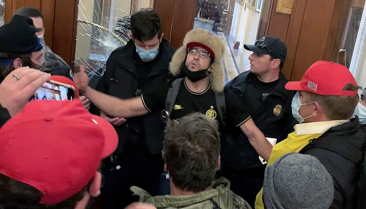 Zachary Alam works up a crowd of protesters outside the Speaker's Lobby at the U.S. Capitol on Jan. 6, 2021. (Sam Montoya/The Epoch Times)