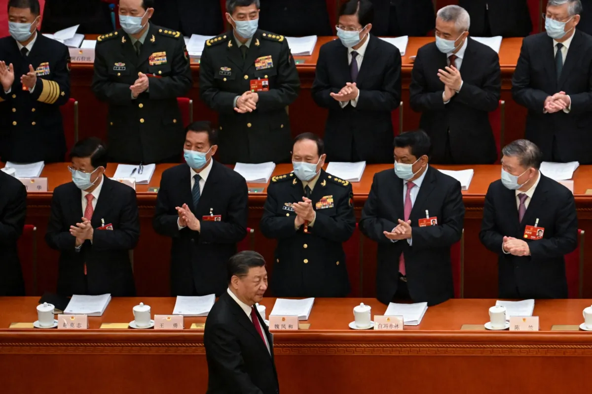 Delegates applaud as Chinese leader Xi Jinping (bottom) arrives for the opening session of China's rubber-stamp legislature, the National People's Congress (NPC), at the Great Hall of the People in Beijing on March 5, 2023. (Noel Celis/AFP via Getty Images)