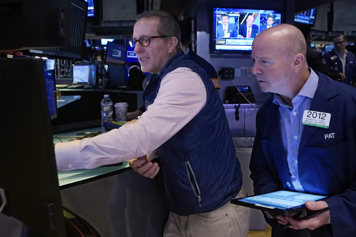 Specialist Glenn Carell (L) and trader Patrick Casey work on the floor of the New York Stock Exchange on Sept. 13, 2023. (Richard Drew/AP Photo)