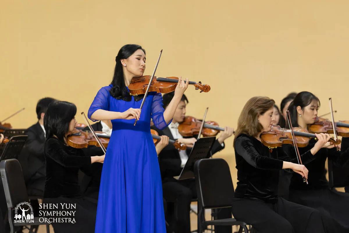 Violinist Debbie Jin with the Shen Yun Symphony Orchestra. (Courtesy of Shen Yun Performing Arts)
