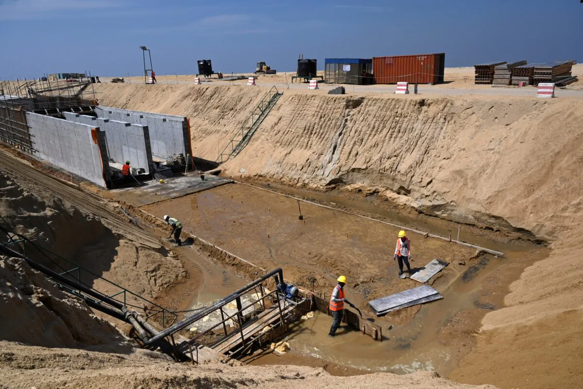 Laborers work at a construction site on reclaimed land, part of China's Belt and Road Initiative, in Colombo, Sri Lanka, on Feb. 24, 2020. (Ishara S. Kodikara/AFP via Getty Images)