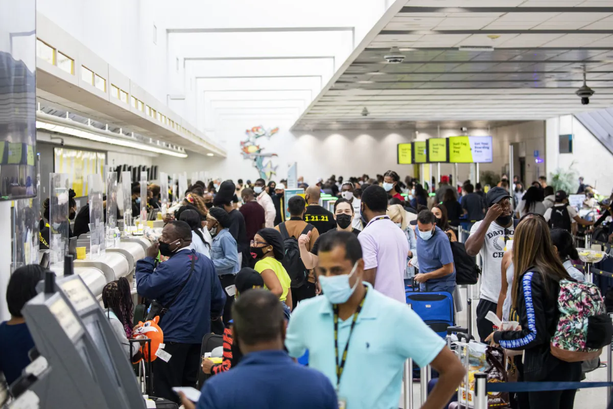 Passengers check in and wait by the Spirit Airlines ticket counter at Fort Lauderdale-Hollywood International Airport. (Chris Day/South Florida Sun Sentinel/TNS)