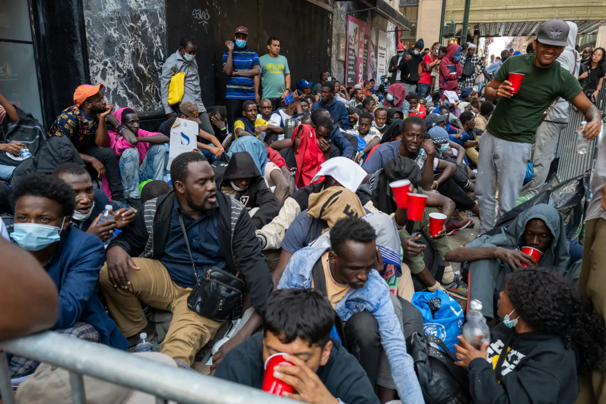 Dozens of recently arrived illegal immigrants camp outside of New York's Roosevelt Hotel, in New York City, on Aug. 1, 2023. (Spencer Platt/Getty Images)
