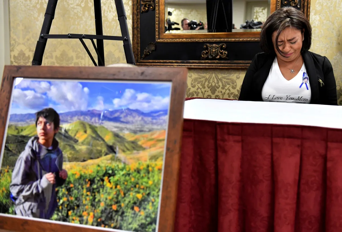 Juana Salcedo, aunt and guardian of 13-year-old Diego Stolz, cries during a news conference in Riverside, Calif., on Oct. 29, 2019. (Will Lester/The Orange County Register via AP)