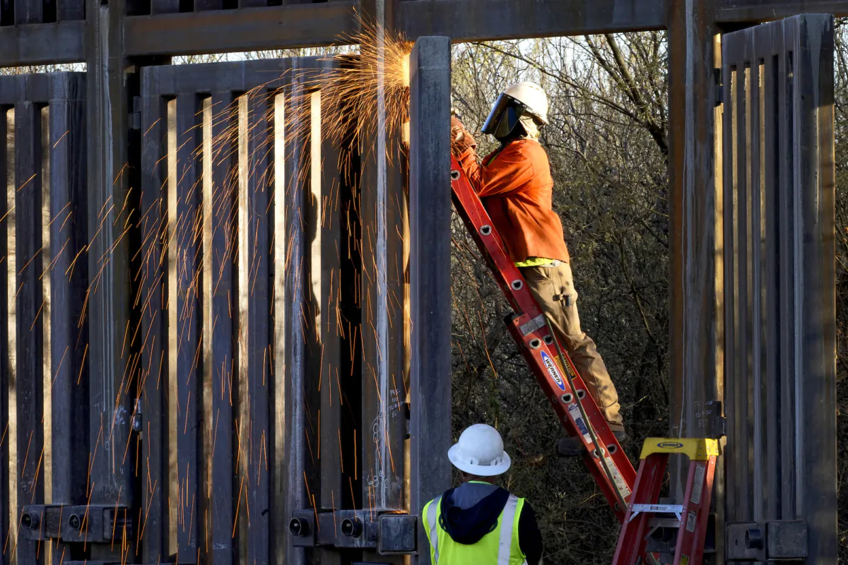 Crews construct a section of border wall in San Bernardino National Wildlife Refuge, in Douglas, Ariz., on Dec. 8, 2020. (AP Photo/Matt York, File)