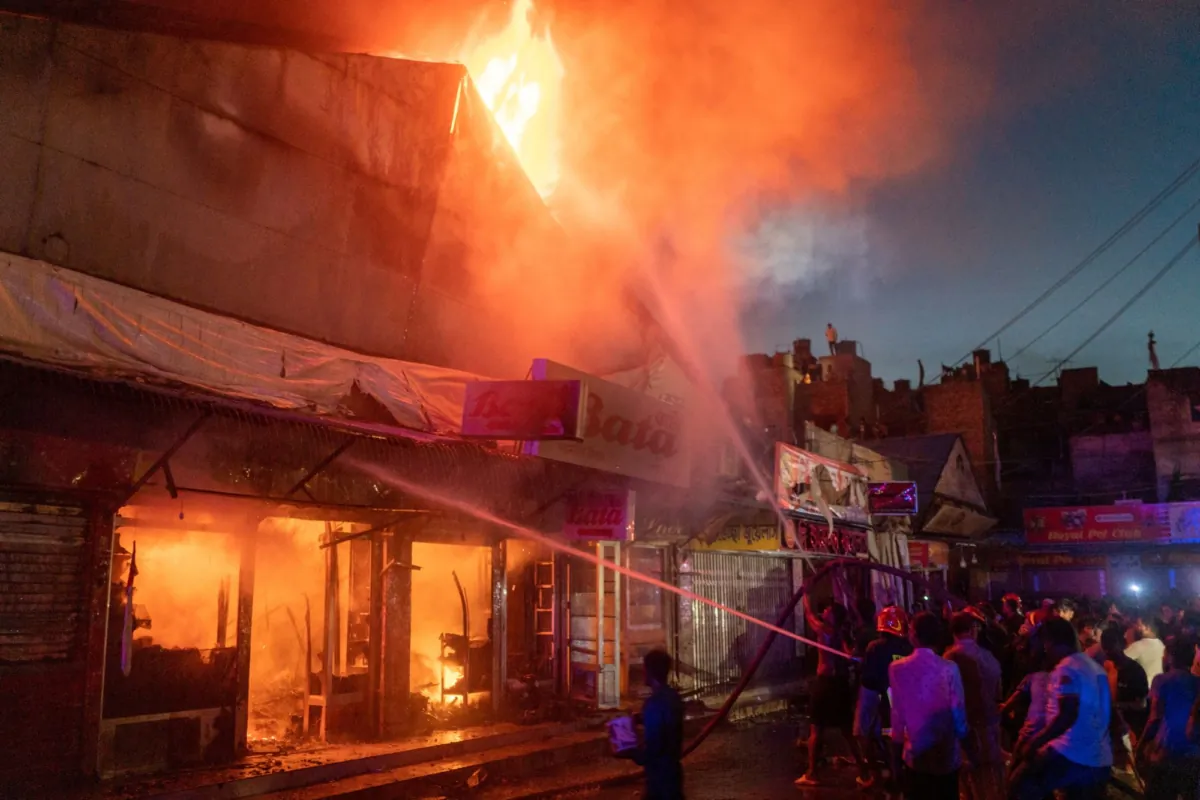 Firefighters work after a fire broke out at the Mohammadpur Krishi Market in, Dhaka, Bangladesh, on Sept. 14, 2023, in this picture obtained from social media. (Arshadul Hoque Rocky/via Reuters)