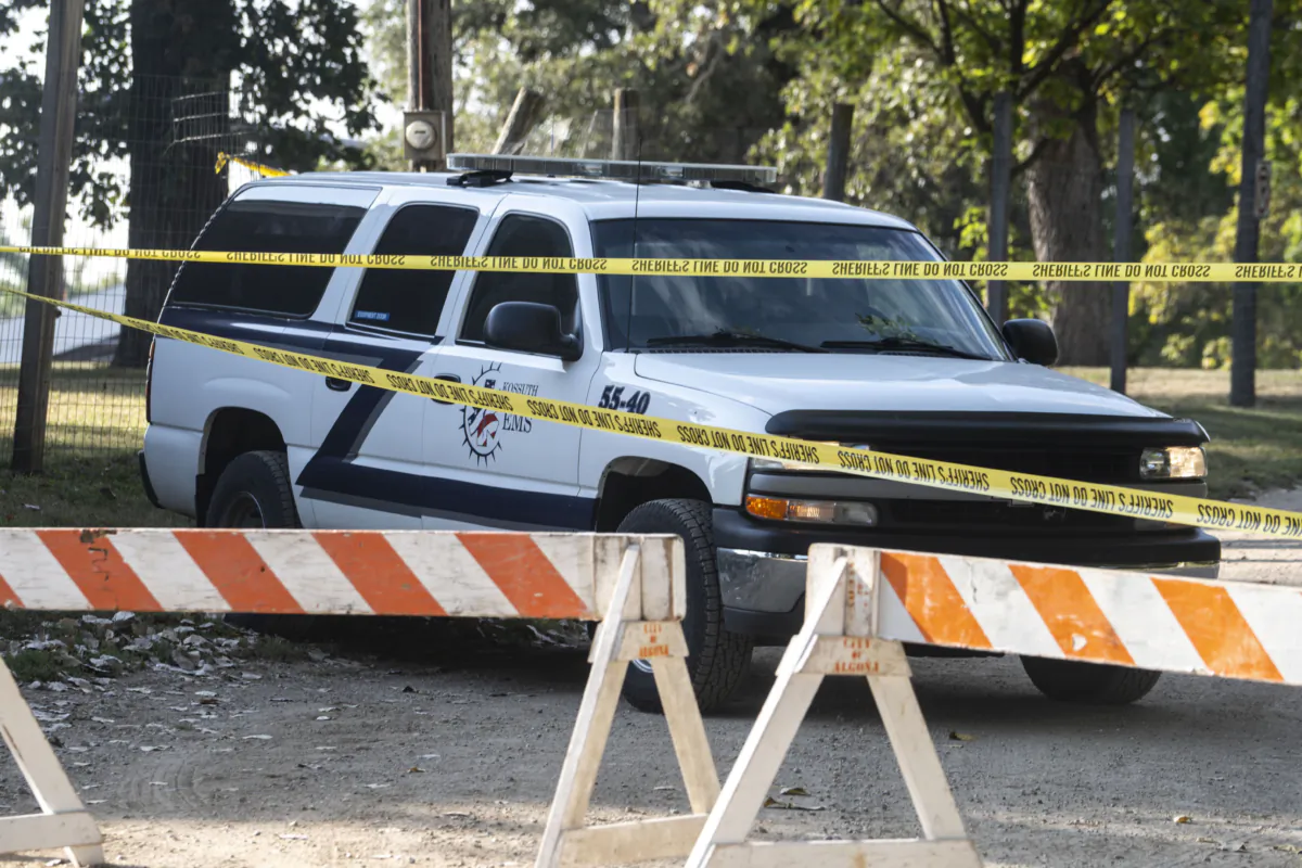 Kossuth County EMS vehicles are at the scene of an officer-involved shooting north of the Kossuth County Fairgrounds on South Minnesota Street in Algona, Iowa, on Sept. 14, 2023. (Lily Smith/The Des Moines Register via AP)