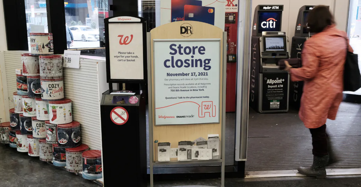 A sign informs customers that a Walgreens pharmacy and convenience store would soon be closing in New York City. A surge in shoplifting is occurring there and in other cities across the country, resulting in store closures, losses of jobs and tax revenues, and other adverse effects. (Spencer Platt/Getty Images)