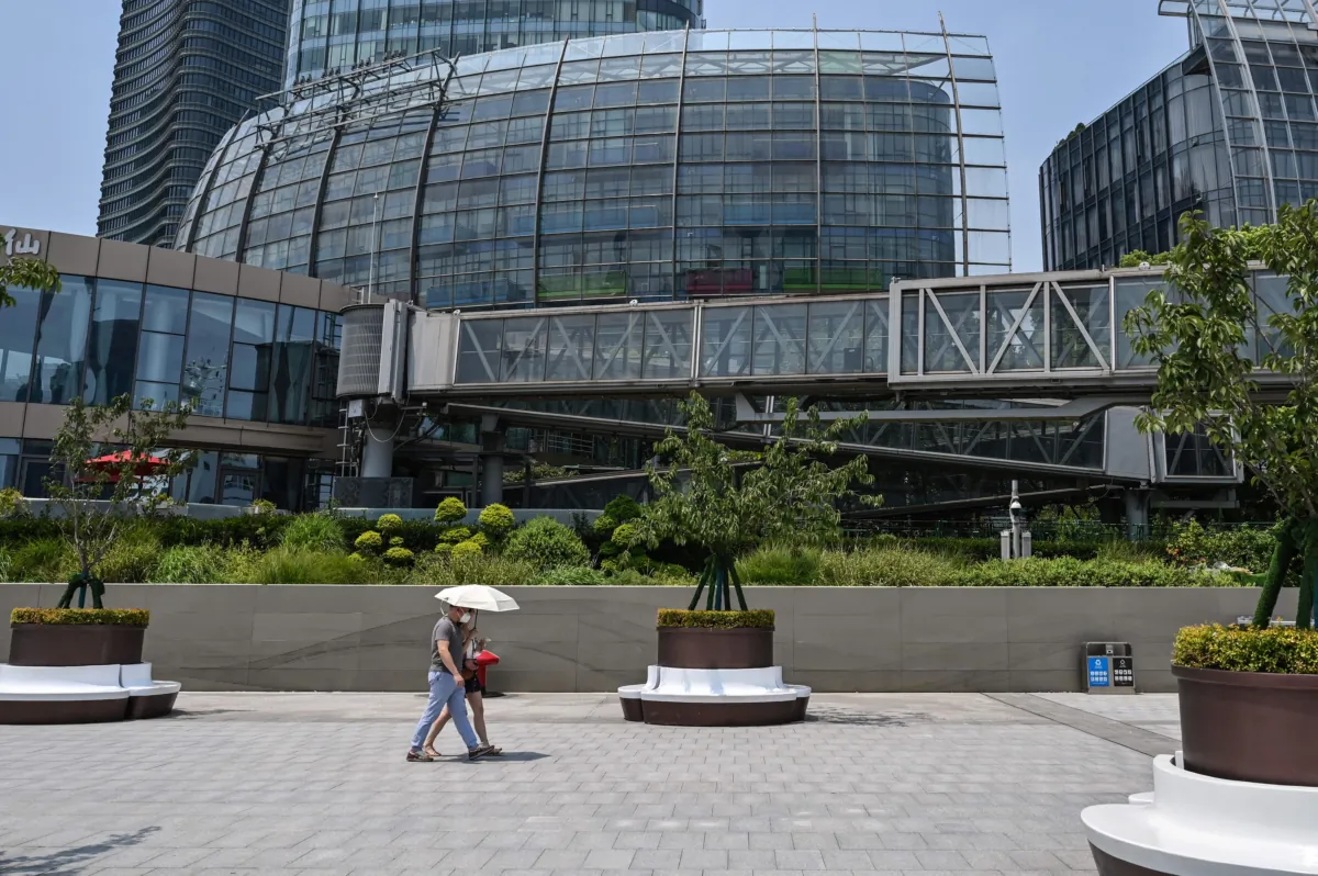 Removed company signage (top L) is seen in a general view of the unoccupied Evergrande Center building in Shanghai on July 27, 2022. (Hector Retamal/AFP via Getty Images)